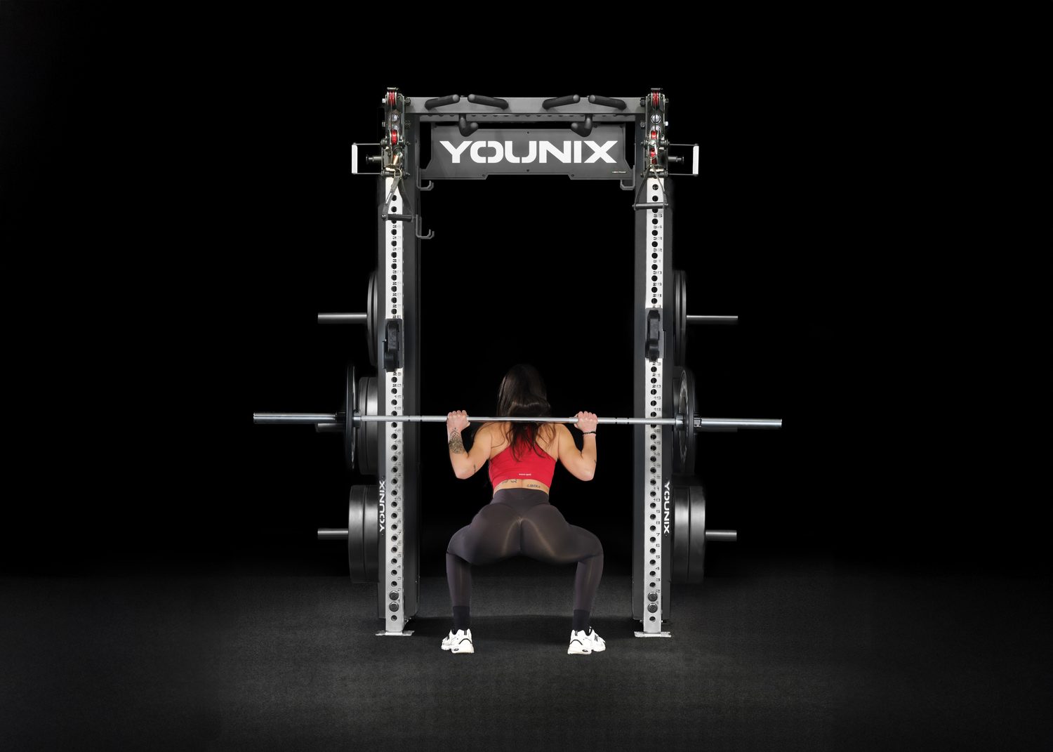 Barbell squat inside the Cable Rack
